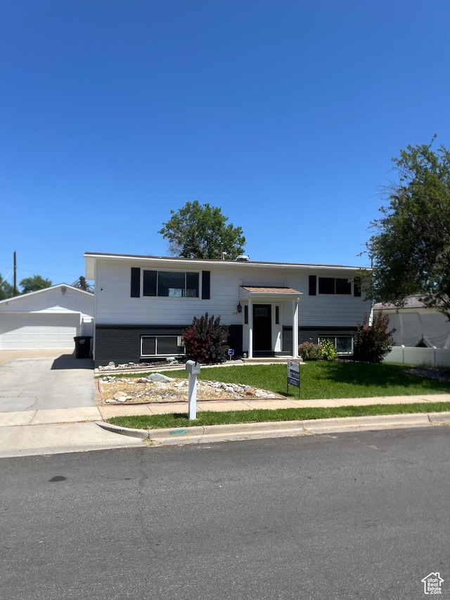 390 W 5050 S, Washington Terrace, UT 84405 - raised ranch with a front yard, an outbuilding, and driveway