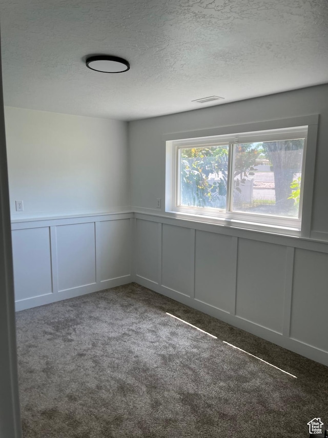 390 W 5050 S, Washington Terrace, UT 84405 - carpeted empty room with a decorative wall, a textured ceiling, and a wainscoted wall