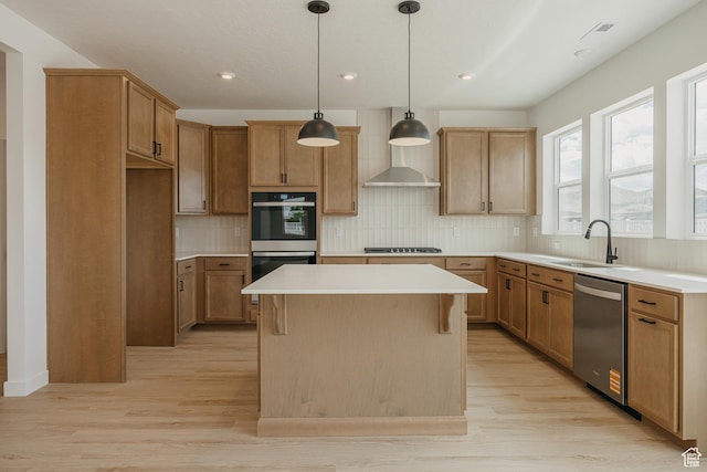 189 N Woodrun Way Unit 131, Saratoga Springs, UT 84045 - kitchen featuring appliances with stainless steel finishes, a kitchen island, light wood-type flooring, decorative backsplash, and light countertops