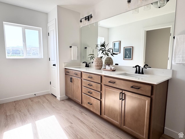 189 N Woodrun Way Unit 131, Saratoga Springs, UT 84045 - bathroom with double vanity and wood finished floors