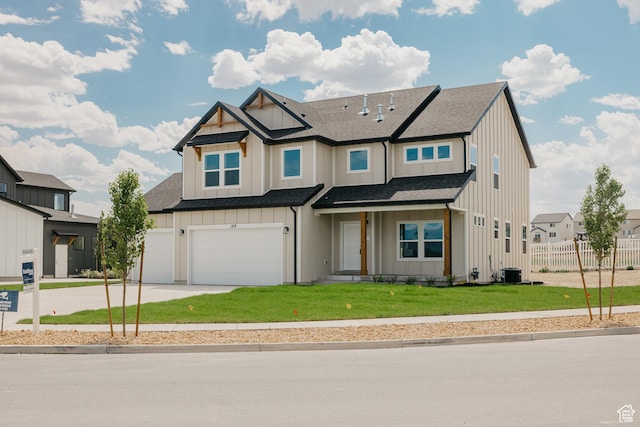 189 N Woodrun Way Unit 131, Saratoga Springs, UT 84045 - view of front of home featuring board and batten siding, driveway, a garage, and a shingled roof