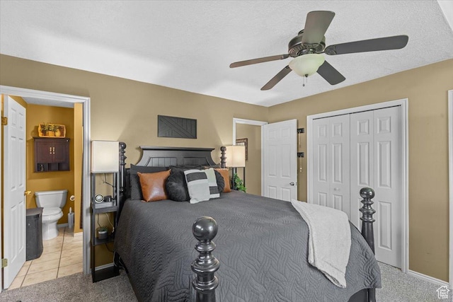 980 E 2850 N, North Logan, UT 84341 - bedroom featuring light colored carpet, a closet, ensuite bathroom, a ceiling fan, and light tile patterned flooring