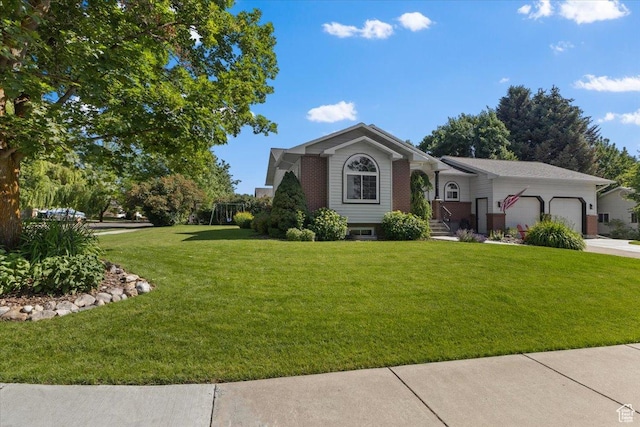 980 E 2850 N, North Logan, UT 84341 - view of front of property featuring a garage, a front lawn, brick siding, and concrete driveway