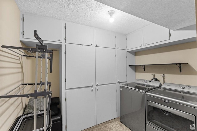 980 E 2850 N, North Logan, UT 84341 - laundry area featuring cabinet space, washer and dryer, and a textured ceiling
