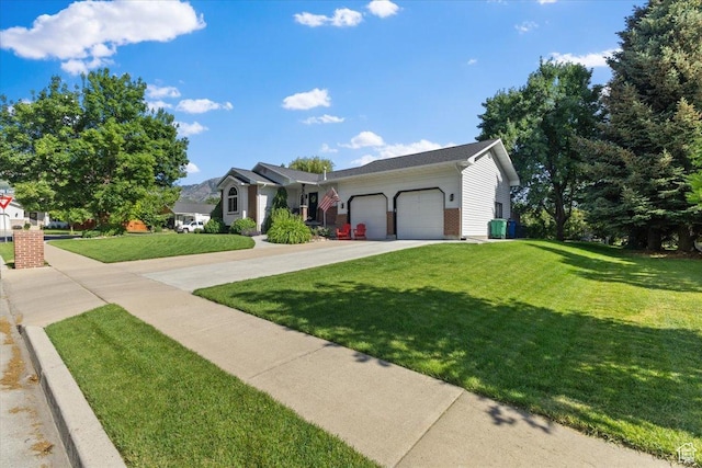 980 E 2850 N, North Logan, UT 84341 - single story home featuring a garage, driveway, and a front lawn