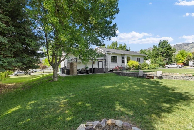 980 E 2850 N, North Logan, UT 84341 - view of front of home with a front lawn and a mountain view