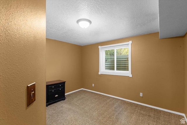 980 E 2850 N, North Logan, UT 84341 - empty room featuring a textured ceiling and carpet flooring