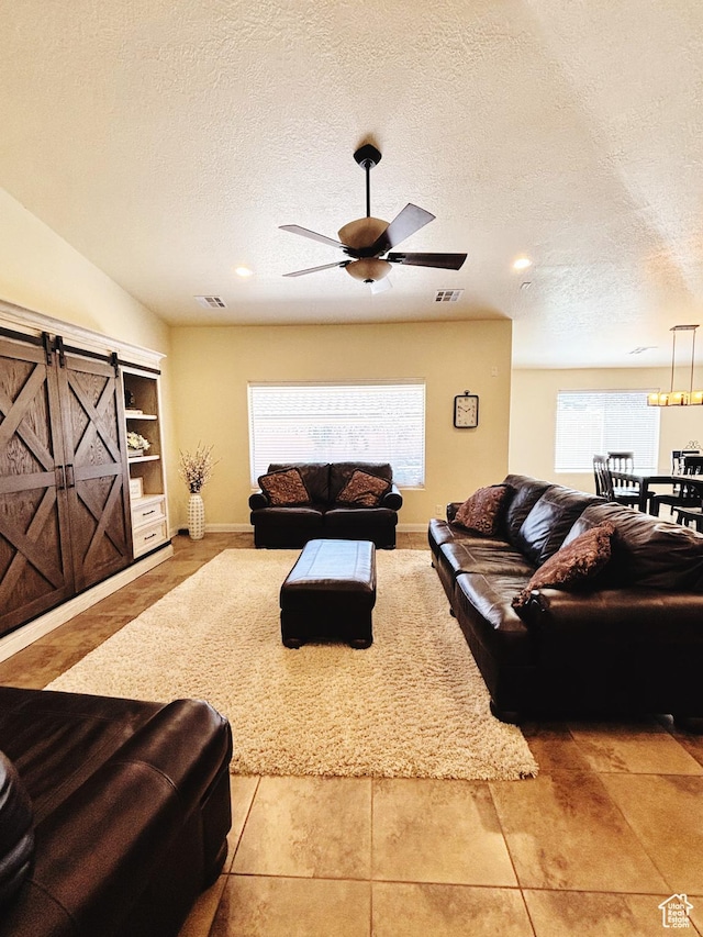 3853 Mitchell Dr, Santa Clara, UT 84765 - tiled living area with plenty of natural light, a ceiling fan, a textured ceiling, and recessed lighting