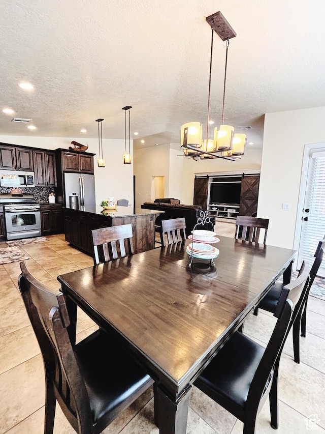 3853 Mitchell Dr, Santa Clara, UT 84765 - dining space with a chandelier, recessed lighting, a textured ceiling, and light tile patterned floors