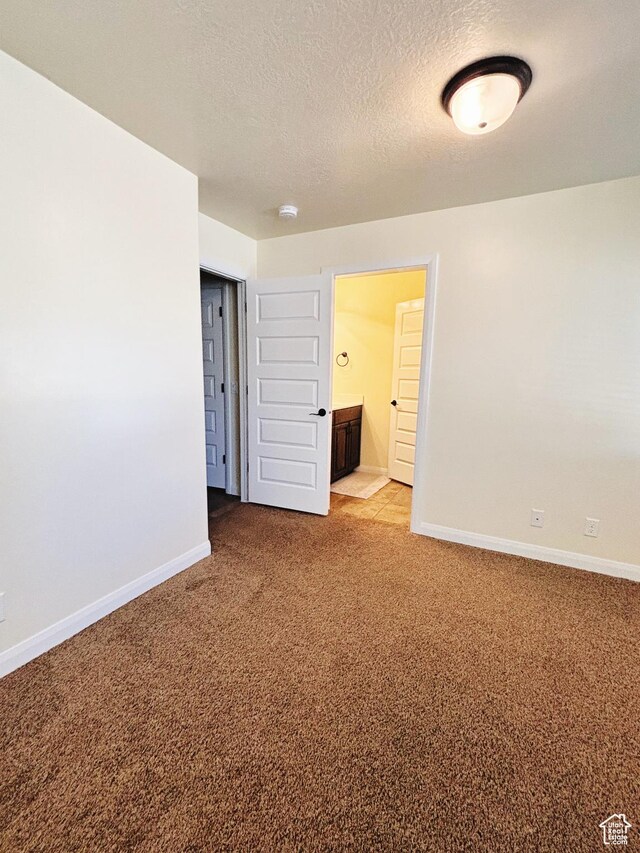 3853 Mitchell Dr, Santa Clara, UT 84765 - empty room featuring light colored carpet, a textured ceiling, and a smoke detector