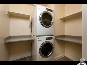 3853 Mitchell Dr, Santa Clara, UT 84765 - washroom featuring estacked washer and dryer and baseboards