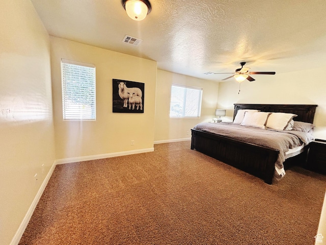 3853 Mitchell Dr, Santa Clara, UT 84765 - carpeted bedroom featuring a ceiling fan and a textured ceiling