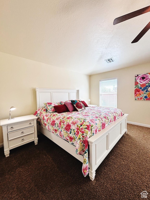 3853 Mitchell Dr, Santa Clara, UT 84765 - bedroom featuring dark colored carpet, ceiling fan, and a textured ceiling