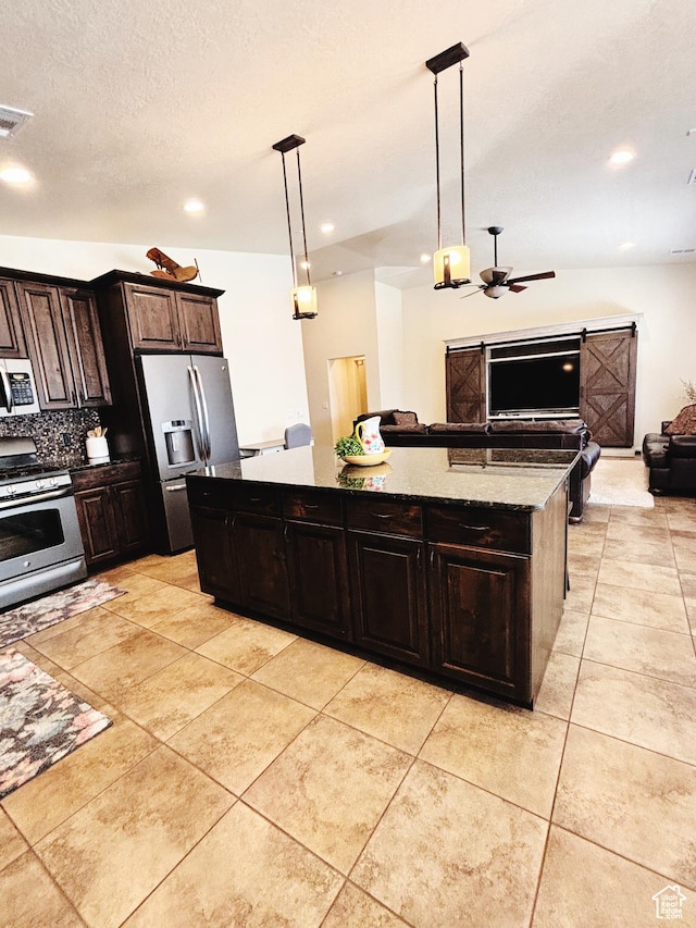 3853 Mitchell Dr, Santa Clara, UT 84765 - kitchen featuring appliances with stainless steel finishes, open floor plan, a kitchen island, ceiling fan, and light tile patterned floors