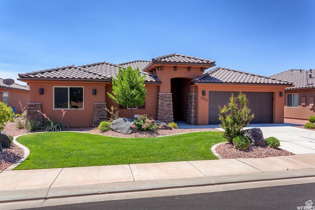 3853 Mitchell Dr, Santa Clara, UT 84765 - mediterranean / spanish home featuring stucco siding, an attached garage, a front yard, and a tiled roof
