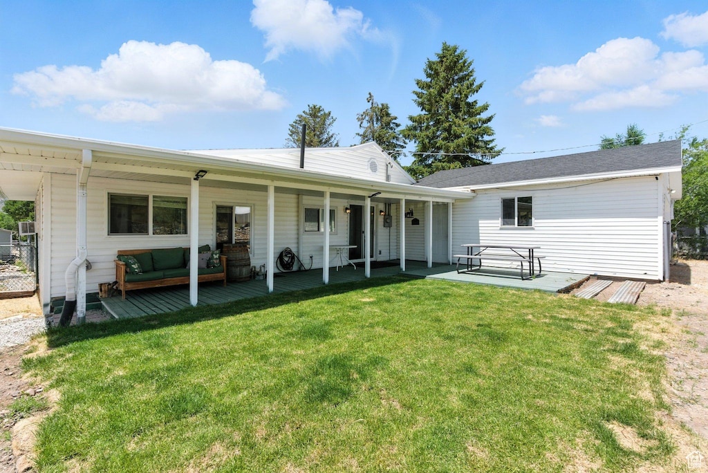 60 S Johnson St, Stockton, UT 84071 - rear view of house featuring a lawn