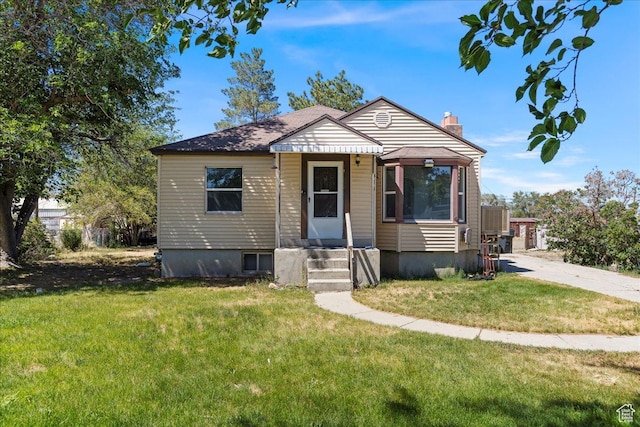 374 W Apple St, Grantsville, UT 84029 - bungalow-style house with a chimney and a front lawn