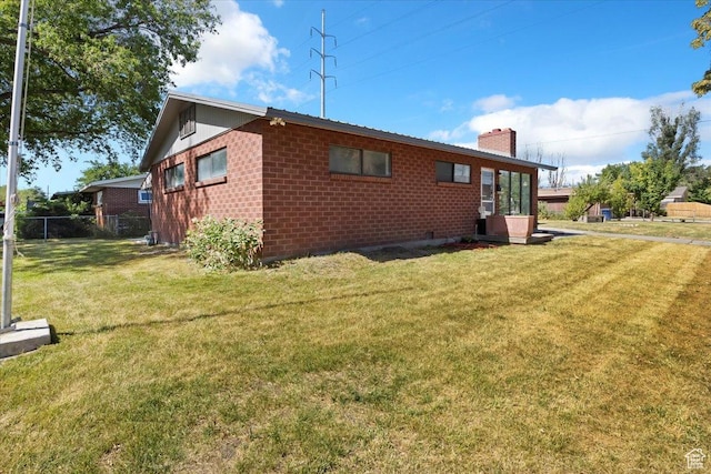 1349 W Goodwin Ave N, Salt Lake City, UT 84116 - back of house with a chimney and brick siding