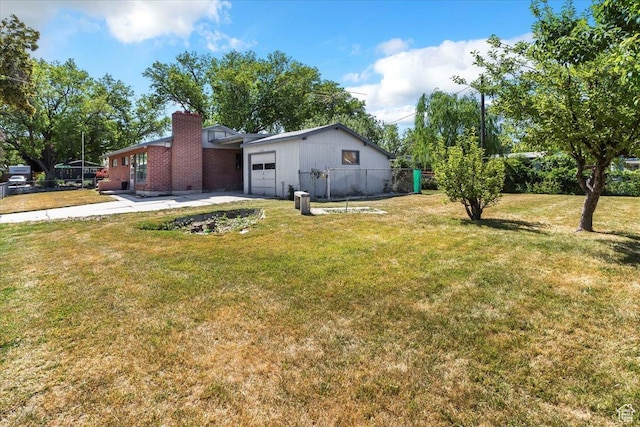 1349 W Goodwin Ave N, Salt Lake City, UT 84116 - view of yard with a garage