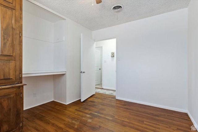 1349 W Goodwin Ave N, Salt Lake City, UT 84116 - empty room with dark wood-style flooring, a textured ceiling, and ceiling fan