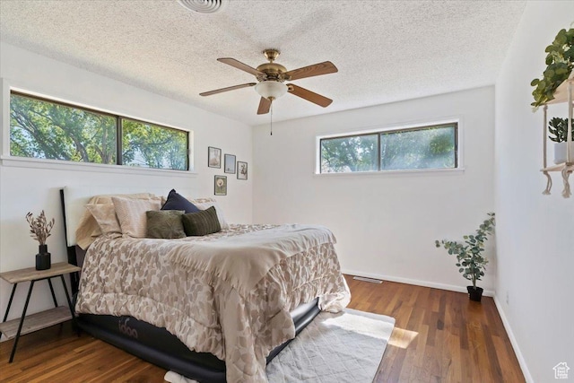 1349 W Goodwin Ave N, Salt Lake City, UT 84116 - bedroom featuring wood finished floors, a textured ceiling, and a ceiling fan