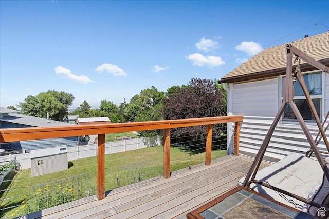 2077 Fillmore Ave, Ogden, UT 84401 - deck with a fenced backyard and a storage unit