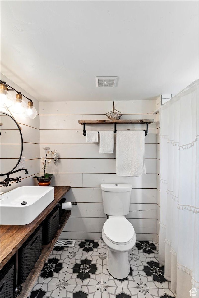 2077 Fillmore Ave, Ogden, UT 84401 - bathroom featuring toilet and vanity