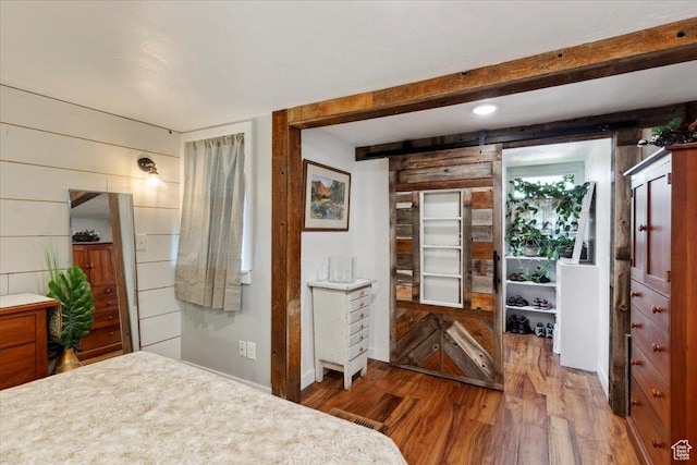 2077 Fillmore Ave, Ogden, UT 84401 - bedroom featuring wood finished floors and wooden walls