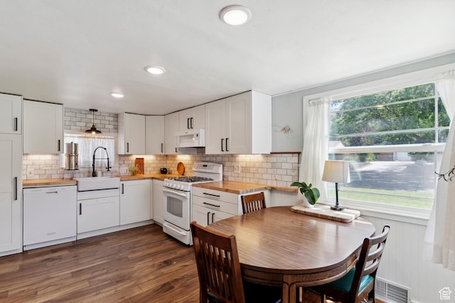 2077 Fillmore Ave, Ogden, UT 84401 - kitchen featuring white appliances, wooden counters, plenty of natural light, white cabinets, and recessed lighting