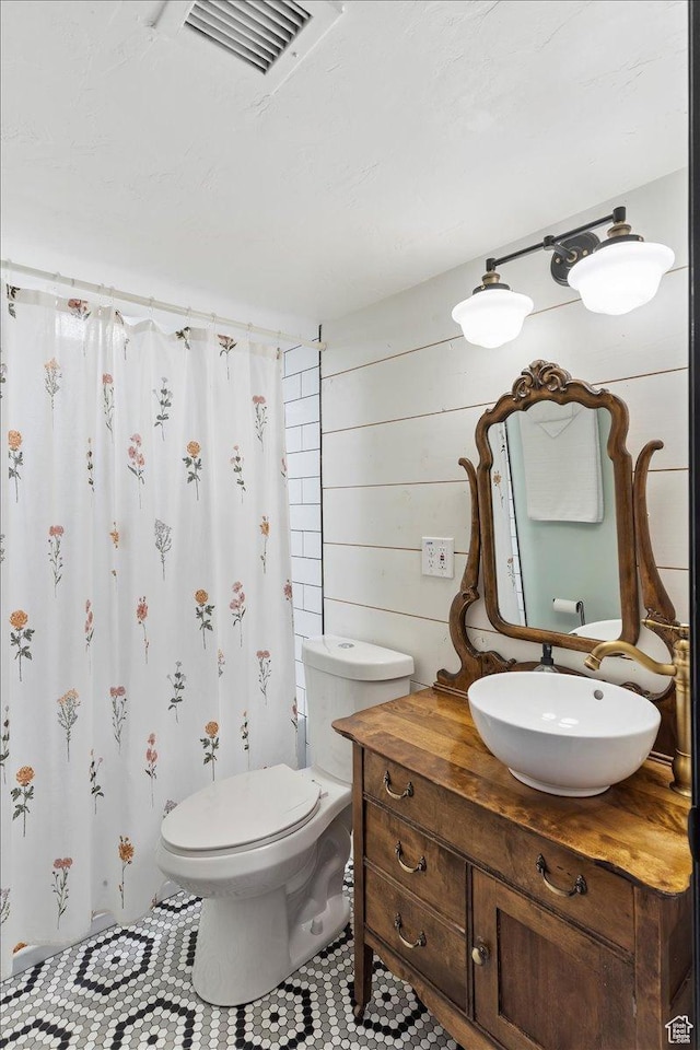 2077 Fillmore Ave, Ogden, UT 84401 - full bath featuring vanity, a shower with shower curtain, and tile patterned flooring