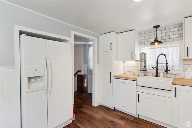 2077 Fillmore Ave, Ogden, UT 84401 - kitchen with white appliances, butcher block countertops, decorative backsplash, and white cabinetry