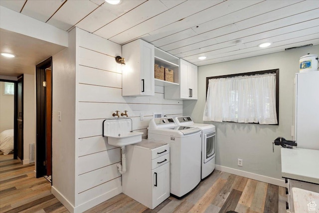 2077 Fillmore Ave, Ogden, UT 84401 - laundry room featuring washer and clothes dryer, light wood-style flooring, and recessed lighting