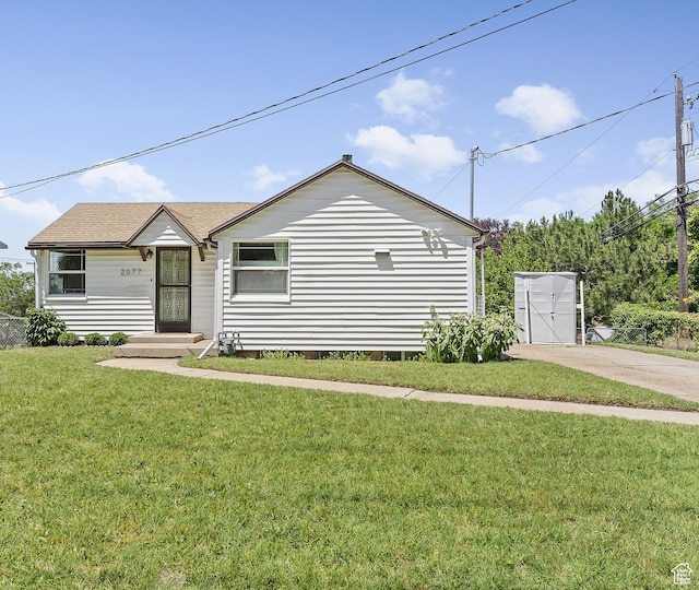 2077 Fillmore Ave, Ogden, UT 84401 - view of front of house with a front lawn