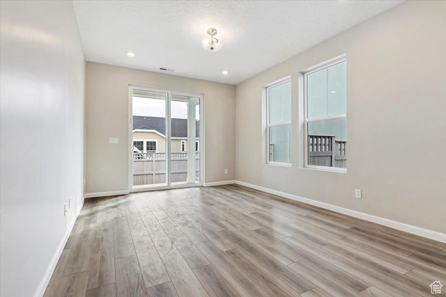 6168 W Franciscotti Dr Unit 605, South Jordan, UT 84009 - empty room featuring wood finished floors and recessed lighting