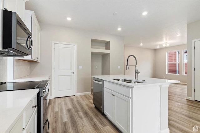 6168 W Franciscotti Dr Unit 605, South Jordan, UT 84009 - kitchen featuring appliances with stainless steel finishes, light wood-style flooring, recessed lighting, decorative backsplash, and white cabinets
