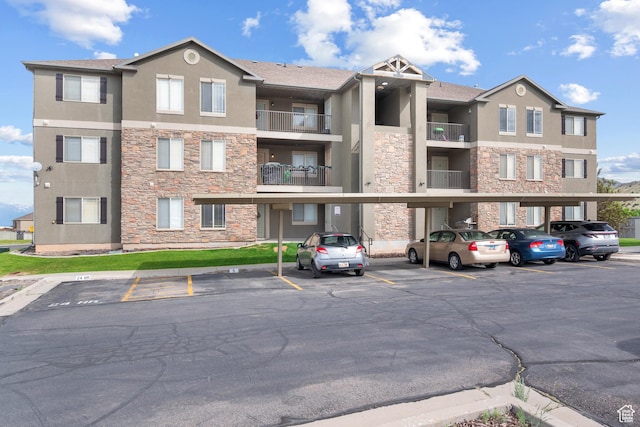 3812 E Rock Creek Rd Unit 5, Eagle Mountain, UT 84005 - view of apartment building / complex with covered parking