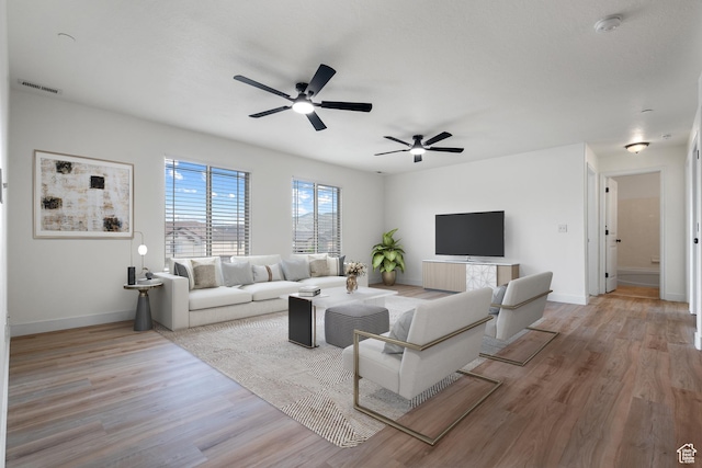 3812 E Rock Creek Rd Unit 5, Eagle Mountain, UT 84005 - living area with ceiling fan and wood finished floors