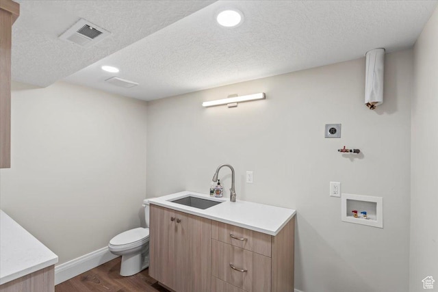 6264 S Dellron Dr, Murray, UT 84123 - washroom featuring electric dryer hookup, dark wood-style floors, washer hookup, a textured ceiling, and recessed lighting