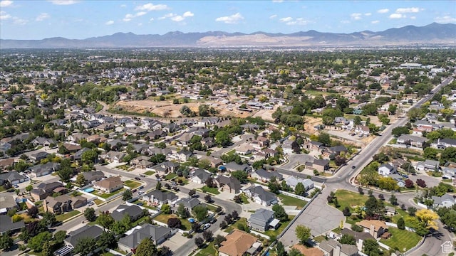 6264 S Dellron Dr, Murray, UT 84123 - aerial view of property's location featuring a mountainous background and nearby suburban area