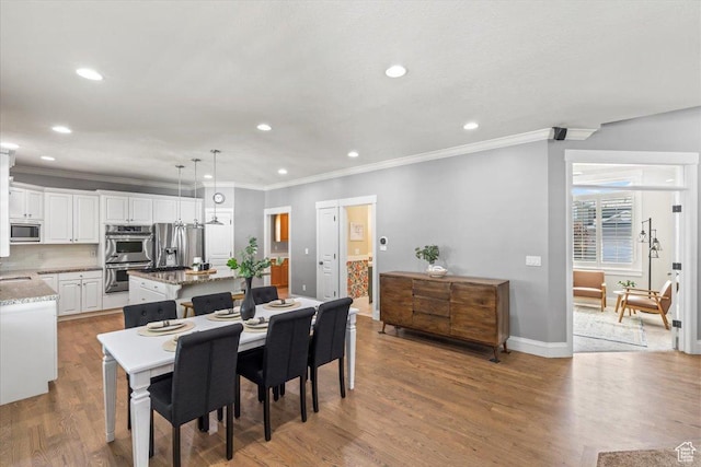 6264 S Dellron Dr, Murray, UT 84123 - dining area featuring ornamental molding, light wood-style floors, and recessed lighting