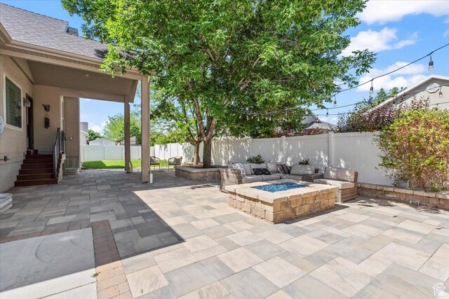6264 S Dellron Dr, Murray, UT 84123 - fenced backyard with a fire pit and a patio area