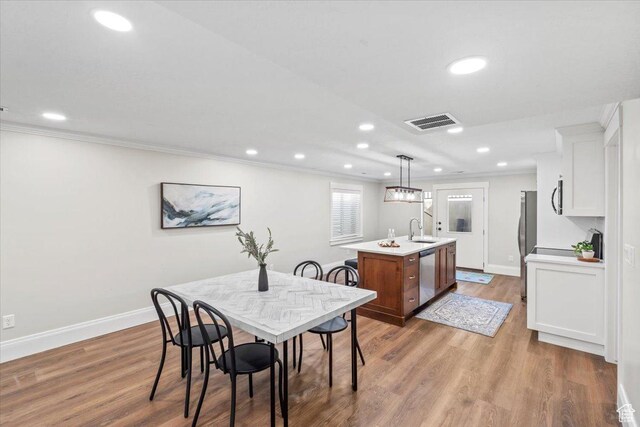 6264 S Dellron Dr, Murray, UT 84123 - dining room with recessed lighting, crown molding, and wood finished floors