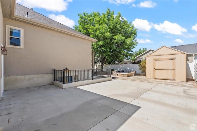 6264 S Dellron Dr, Murray, UT 84123 - view of patio featuring a storage unit