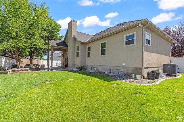 6264 S Dellron Dr, Murray, UT 84123 - back of property featuring a patio area, a chimney, and stucco siding