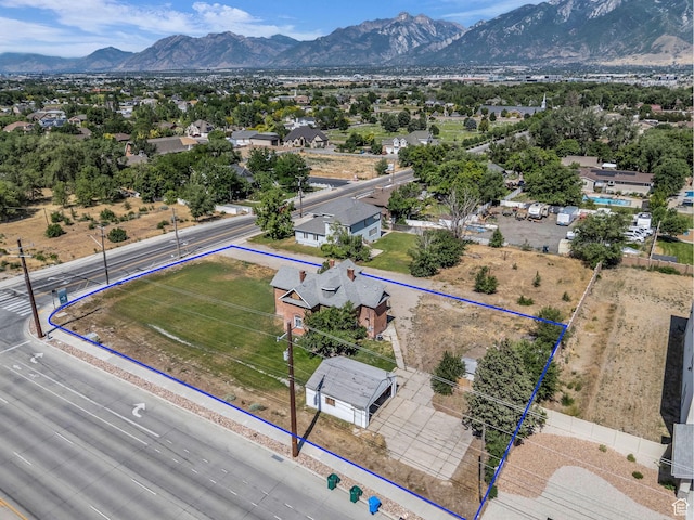 13225 S Redwood Rd, Riverton, UT 84065 - aerial perspective of suburban area with property parcel outlined and mountains