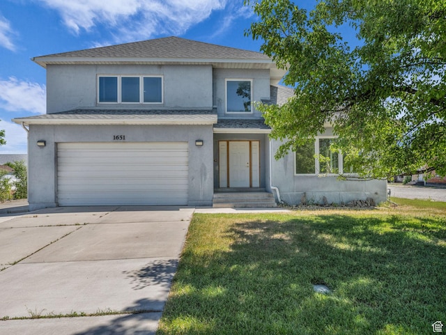 1651 W 13200 S, Riverton, UT 84065 - view of front of house featuring stucco siding, a front lawn, a garage, concrete driveway, and roof with shingles