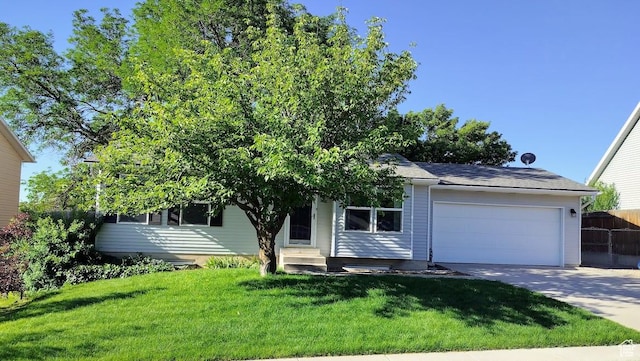 5373 W 6600 S, West Jordan, UT 84081 - view of property hidden behind natural elements with entry steps, an attached garage, and driveway
