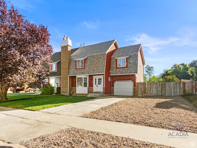 1285 S 550 E, Springville, UT 84663 - dutch colonial featuring roof with shingles, a gambrel roof, a chimney, driveway, and a garage