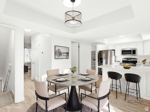 1285 S 550 E, Springville, UT 84663 - dining space featuring a tray ceiling and light wood finished floors