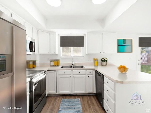 1285 S 550 E, Springville, UT 84663 - kitchen featuring stainless steel appliances, a peninsula, light countertops, and white cabinetry